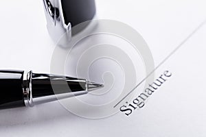 Macro closeup sign document contract pen filler