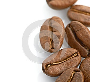 Macro of coffee beans on white background