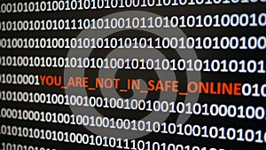 Computer screen shot with binary code and warning text, concept for computer, technology and online security.