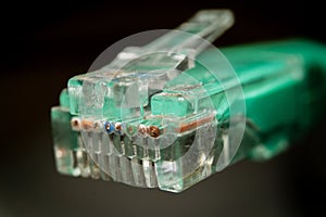 Macro cross section front angle view of RJ45 CAT6 shielded network data internet cable clear connector