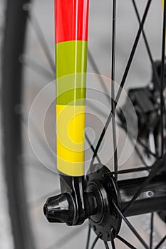 Macro detail of a coloured fixie bike fork