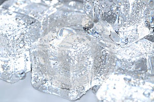 Macro detail of ice cubes with water droplet