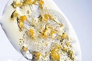 Macro detail of liquid cannabis oil extraction aka shatter