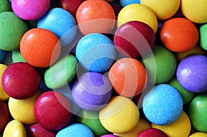 Macro detail of pile of colored smarties
