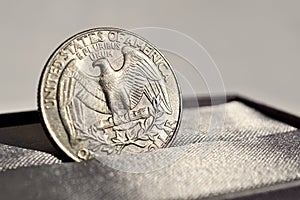 Macro detail of a silver coin of One American Dollar (USD, United States of America Dollar)