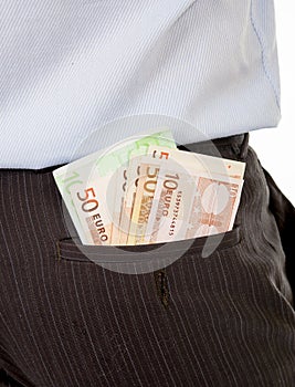 Macro of euro banknotes in business man suit pants back pocket