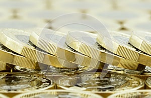 Macro fallen stack of new British one pound coins