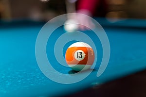 Macro focus on billiard ball, blue table background