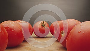 Macro footage in motion of some tomatoes on the table