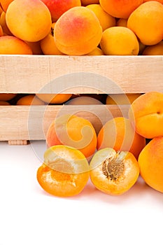 Macro of fresh apricots (Prunus armeniaca) in wooden crate