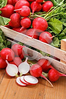 Macro of fresh sliced radish in crate