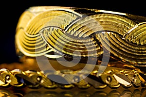 Macro gold bangle Jewelery on black background, Traditional indian gold bangles