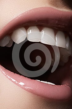 Macro happy female smile with healthy white teeth