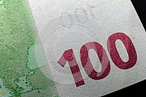 A macro of the hundred euro banknote, number 100 and copyspace