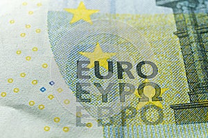 Macro of hundred euro banknote with words EURO in different european languages