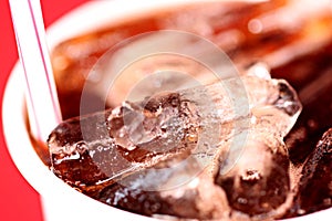 Macro Ice in a glass of Coca-Cola.