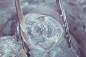 Macro ice in metal bucket in the restaurant