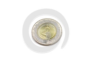 A macro image of a 2 Saudi Riyal coin on white