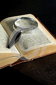 Macro Image of Antique Books with Magnifier