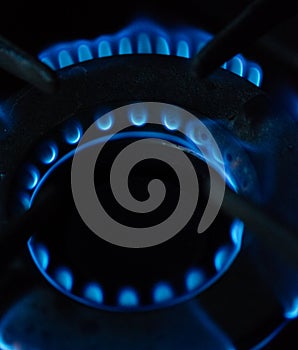 A Macro Image of a Blurry Blue Flames on Gas Stove Burner