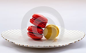 Macro image of colourful macarons on a white plate