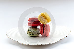 Macro image of colourful macarons on a white plate