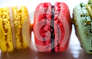 Macro image of colourful macarons on a white plate