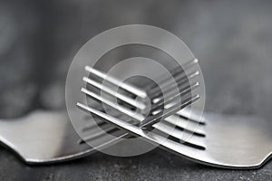 Macro image of cutlery forks on rustic background