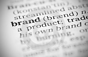 Macro image of dictionary definition of brand