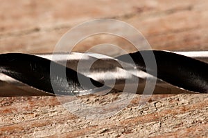 Macro image of Drill bits for wood on wooden desk.