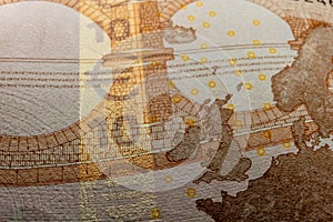 A macro image of the red microprint and fluorescent ink on a Euro banknote, highlighting the advanced tamper-proof photo