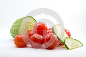 Macro Image of Sliced Cucumber and Mini Red Tomatoes Isolated on white Background