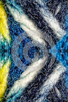 Macro image of a textile material symmetricaly reflected
