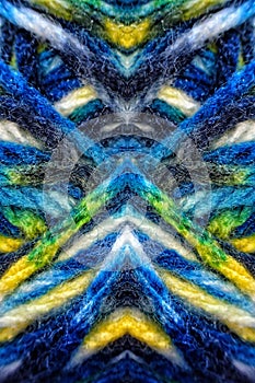 Macro image of a textile material symmetricaly reflected