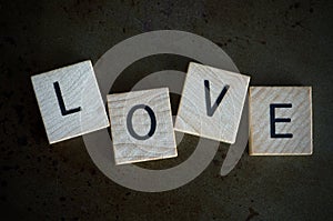 Macro Image of the Word Love On Metal Background