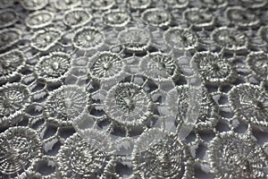 Macro of ivory white lacy fabric