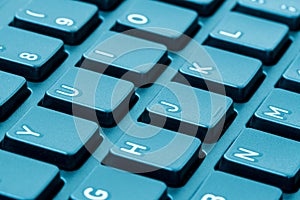 Macro of a keyboard with a blue tone