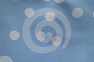 Macro of light blue rayon with polka dot pattern photo