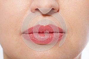 Macro lips makeup. Close up female mouth. Plump full lips. Close-up pores and face details. Collagen and face injections. Anti agi