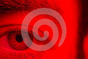 Macro on man eye expressing serious and expressionless expression