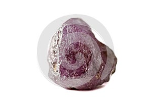 Macro mineral stone alexandrite red - violet in daylight on a white photo
