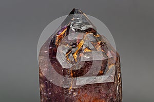 Macro mineral stone  amethyst with smoky quartz on a black background
