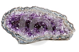 Macro Mineral Stone Amethysts in the rock on a white background close up photo