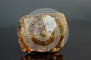 Macro mineral stone Andradite on a black background