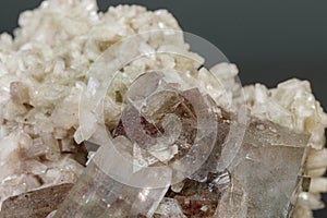 Macro mineral stone Apophyllite stilbite on a gray background