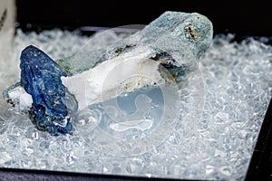 Macro mineral stone Benitoite on a black background