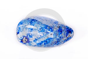 Macro mineral stone blue lapis lazuli afghanistan on white bac