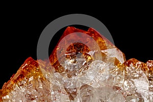 Macro mineral stone Citrine in rock in crystals on a black background