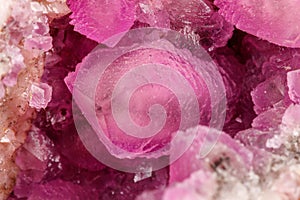 Macro mineral stone Cobalt Calcite rock on white background