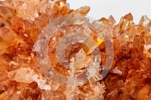 Macro of mineral stone Creedite on microcline on white background